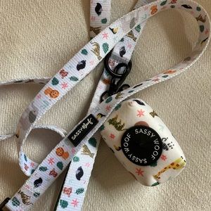 Sassy woof leash and poop bag holder